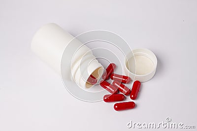 Red capsule white bottle Stock Photo