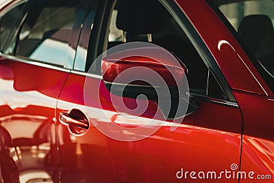 Red car in dealership showroom, new cars sale, automotive background Stock Photo