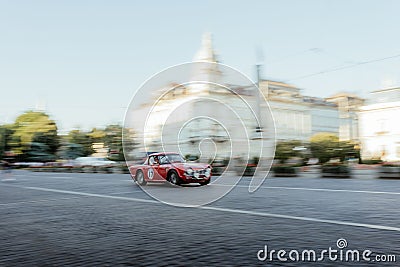 Red car driving during the Retro Rally from Ypres to Istanbul in Arad, Romania Editorial Stock Photo