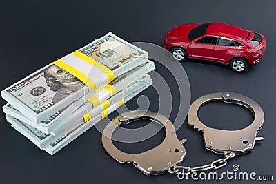 Red car money handcuffs. breaking the law auto dealer Stock Photo