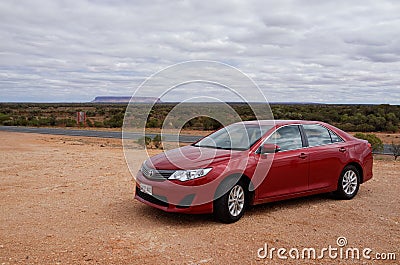 Red Car and Mt Connor in Outback Australia Editorial Stock Photo