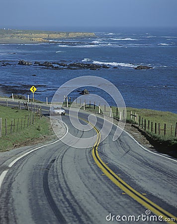 Red car on Pacific Coast Highway, CA Editorial Stock Photo