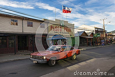 A red car in a street of the town of Coyhaique in Chile, South America Editorial Stock Photo