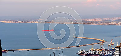 Red cargo ship in Haifa Bay Stock Photo