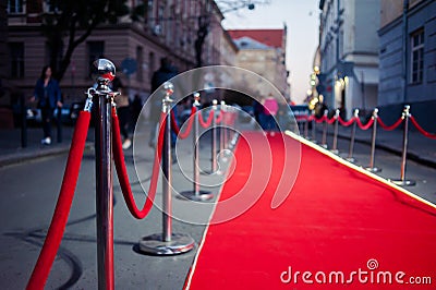 Long Red Carpet - is traditionally used to mark the route taken by heads of state on ceremonial and formal occasions Stock Photo