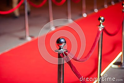 Long Red Carpet - is traditionally used to mark the route taken by heads of state on ceremonial and formal occasions Stock Photo