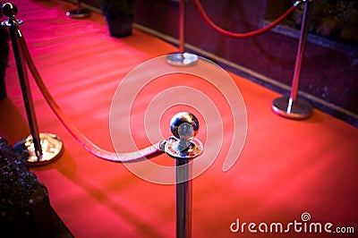 Long Red Carpet - is traditionally used to mark the route taken by heads of state on ceremonial and formal occasions Stock Photo