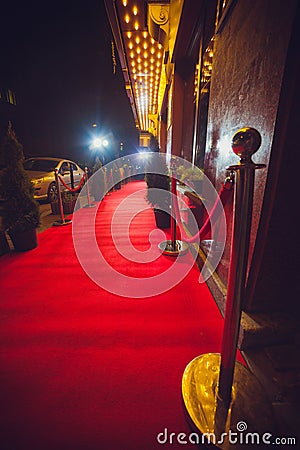 Long Red Carpet - is traditionally used to mark the route taken by heads of state on ceremonial and formal occasions Stock Photo