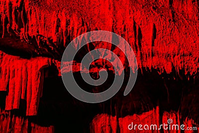 Red Cave with stalactites background Stock Photo