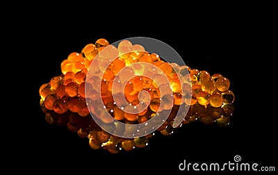 Red caviar close up. Salmon caviar isolated on black background. Delicious gourmet food Stock Photo