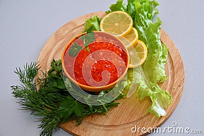Red caviar and fresh greens Stock Photo
