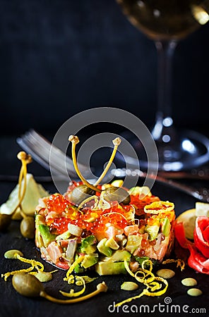 Red caviar, salmon and avocado tartar Stock Photo