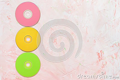 CD or DVD discs on pink background Stock Photo
