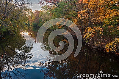 Red Cedar river winding through Michigan State University campus during the Fall Stock Photo