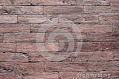 Red ceramic slabs imitating wood on wall Stock Photo