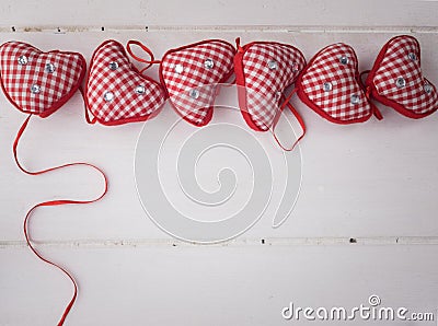 Red check hearts on rustic white wooden background Stock Photo