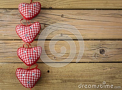 Red check hearts on rustic wooden background Stock Photo