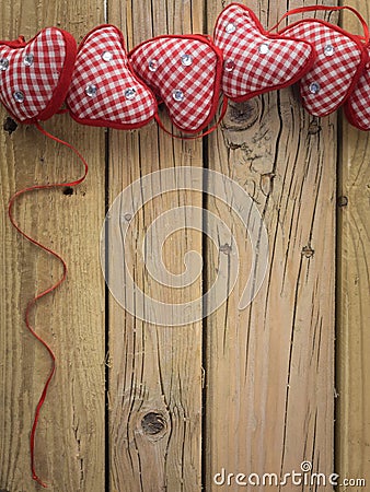 Red check hearts on rustic wooden background Stock Photo