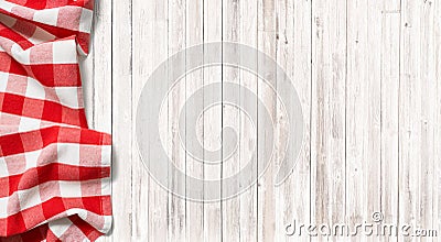 Red checkered picnic tablecloth on subtle wood table Stock Photo