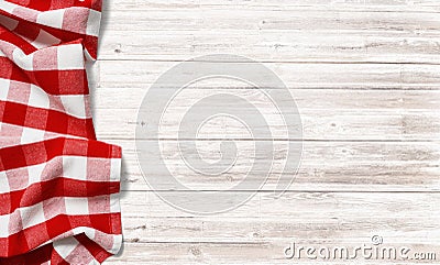 Red checkered picnic tablecloth on white wood table Stock Photo