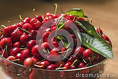 Red cherries in bowl Stock Photo