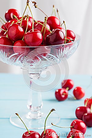 Red cherries in crystal vase Stock Photo