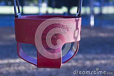 A red childs swing Stock Photo