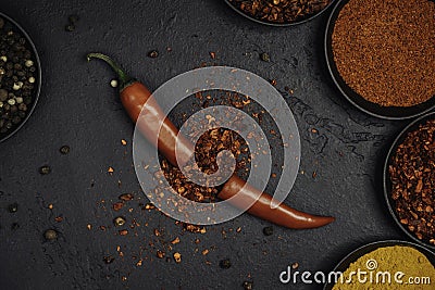 Red chili exploded into small pieces. Pepper in a bowl. Stock Photo