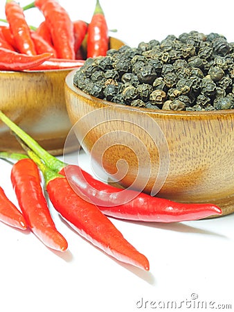 Red chili pepper and black pepper spicy on white Stock Photo
