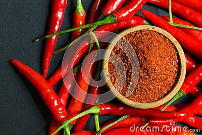 Red chili peppers and chili flakes Stock Photo