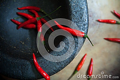 Red chili peppers in Mortar, Thai Kitchen Style Stock Photo
