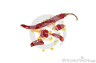 Red chilli exploded into small pieces with many seed inside and dried chili powder isolated on white background. Stock Photo