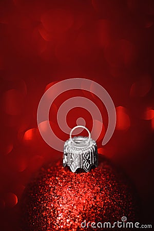 Red christmas ball close-up on glitter background Stock Photo