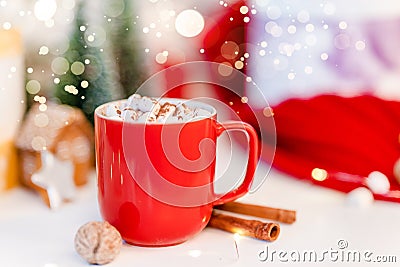 Red Christmas cocoa mug with marshmallow on a background with gingerbread. Copy space banner Stock Photo