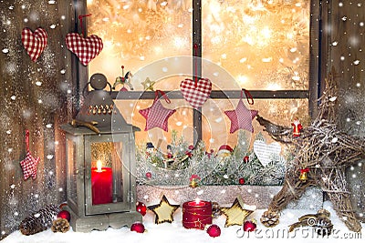 Red Christmas decoration with lantern on window sill with wood Stock Photo