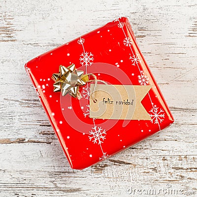 A red christmas gift with a label Stock Photo