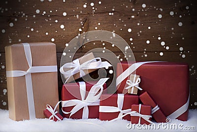 Red Christmas Gifts And Presents With White Ribbon, Snowflakes Stock Photo