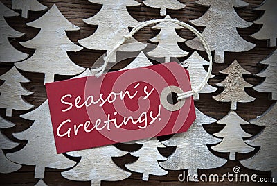 Red Christmas Label With Seasons Greetings Stock Photo