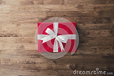 Red Christmas and New Year holidays gift box on wood table Stock Photo
