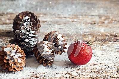 Red christmas ornament pine cones on wooden Stock Photo