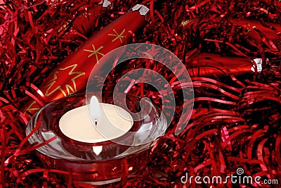 Red Christmas ornaments and candle Stock Photo