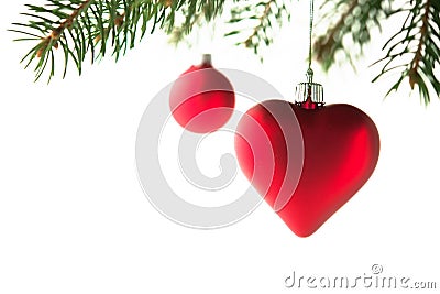 Red christmas ornaments heart and ball on the xmas tree on white background isolated. Stock Photo