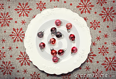 Red Christmas ornaments on white. Canvas background with red glitter snowflakes. Xmas card. Happy New Year. Space Stock Photo