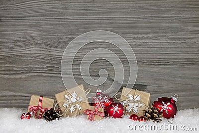 Red Christmas presents wrapped in natural paper on old wooden gr Stock Photo