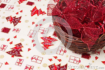 Red christmas ribbons in wicker basket Stock Photo