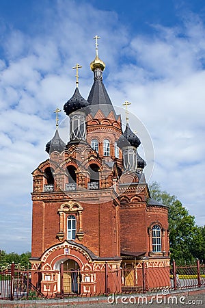 Red Church with black cupolas Stock Photo