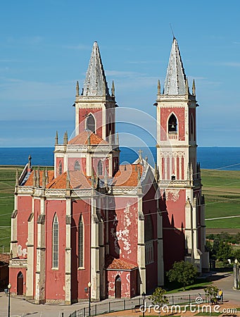 Red church with a blue sea Stock Photo