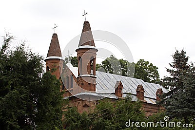 red church, church with towers, ancient church, brick walls, protective castle, princely court Stock Photo
