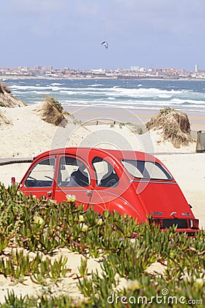 Red Citroen 2CV on a Beach Editorial Stock Photo