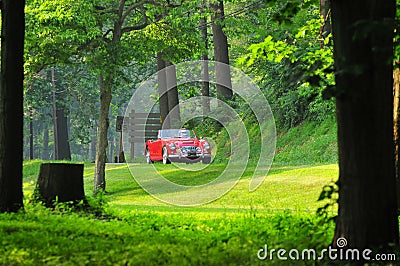 Red classic car on the road Stock Photo